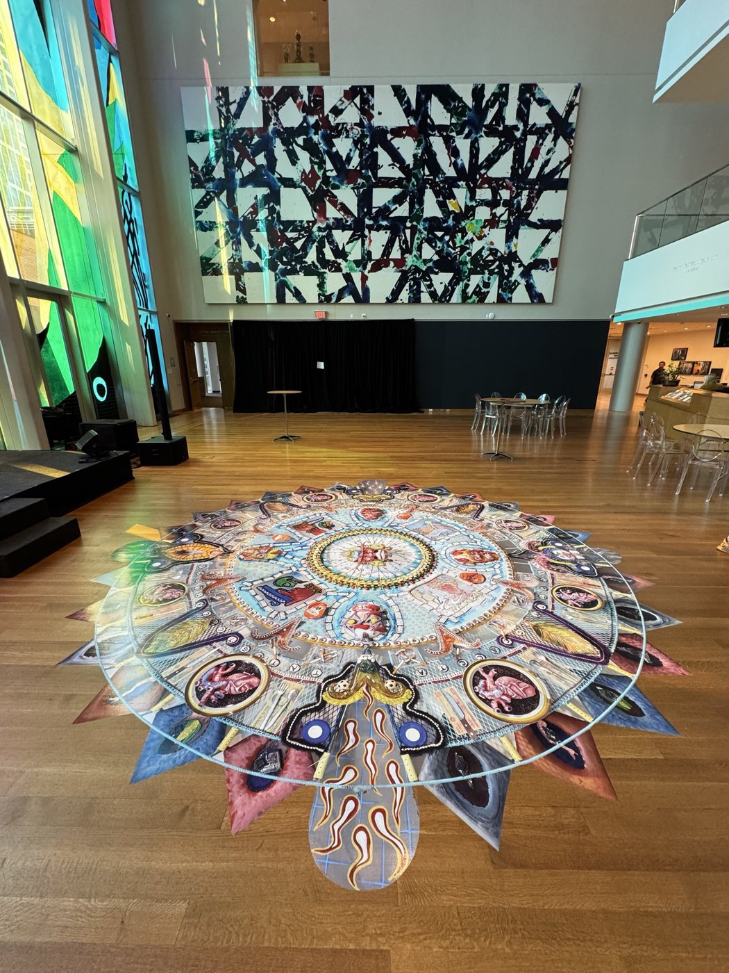 Large circular multicolor floor wrap for the Collidoscope: de la Torre Brothers Retro-Perspective exhibition at The Mint Museum, Charlotte